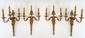 Importante suite de quatre appliques en bronze à trois lumières, style Louis XV, XXème.||||||||