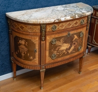 A Commode in Louis XVI Style.