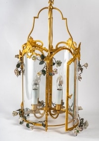 A Louis XV style lantern decorated with porcelain flowers.
