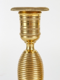 Paire de petits bougeoirs dit Ragot en bronze ciselé et doré époque Empire vers 1810