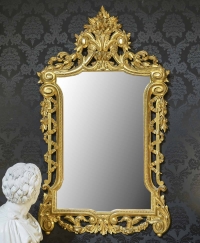 Miroir XVIII eme en bois doré et sculpté