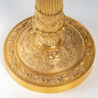 Paire de flambeaux montés en lampes à décor de panier fleuri en bronze doré époque Restauration vers 1820-1830