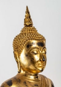 A gilt lacquered bronze Buddha.