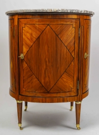 Commode ou meuble de milieu circulaire ouvrant à quatre portes en marqueterie époque Louis XVI