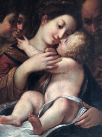 Virgin with the Child surrounded by Angels and Saint Joseph.