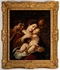 Vierge à l&#039;enfant entourée d&#039;anges et de saint Joseph.