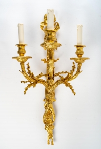 A Pair of wall-lights in Louis XVI style dated 1881.