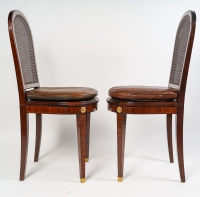 Paire de chaises en marqueterie, bronze doré et galette de cuir, XIXème siècle