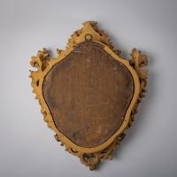Miroir italien en bois sculpté et doré d&#039;époque Régence