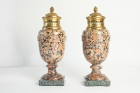 A pair of period Louis XVI rose granite urns with gold gilt bronze. 18th Century. C.1780.