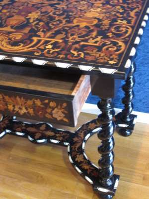 A Napoleon III period (1848 - 1870) marquetry table in Louis XIV style.