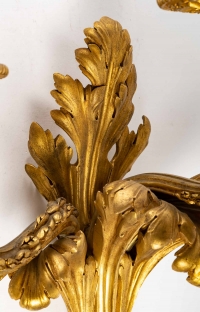Série de quatre appliques en bronze doré. XIXème siècle.
