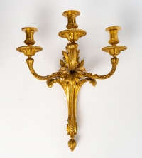 Série de quatre appliques en bronze doré. XIXème siècle.