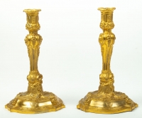A Pair of candlesticks in Louis XV style.