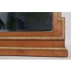 Miroir en bois et stuc doré de forme néoclassique de la fin du XIXème siècle. | Biron Miroir en bois et stuc doré de forme néoclassique de la fin du XIXème siècle.