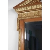 Miroir en bois et stuc doré de forme néoclassique de la fin du XIXème siècle. | Biron Miroir en bois et stuc doré de forme néoclassique de la fin du XIXème siècle.