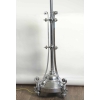 Lampadaire en métal chromé du début du XXème siècle de style Louis XVI. | Biron Lampadaire en métal chromé du début du XXème siècle de style Louis XVI.