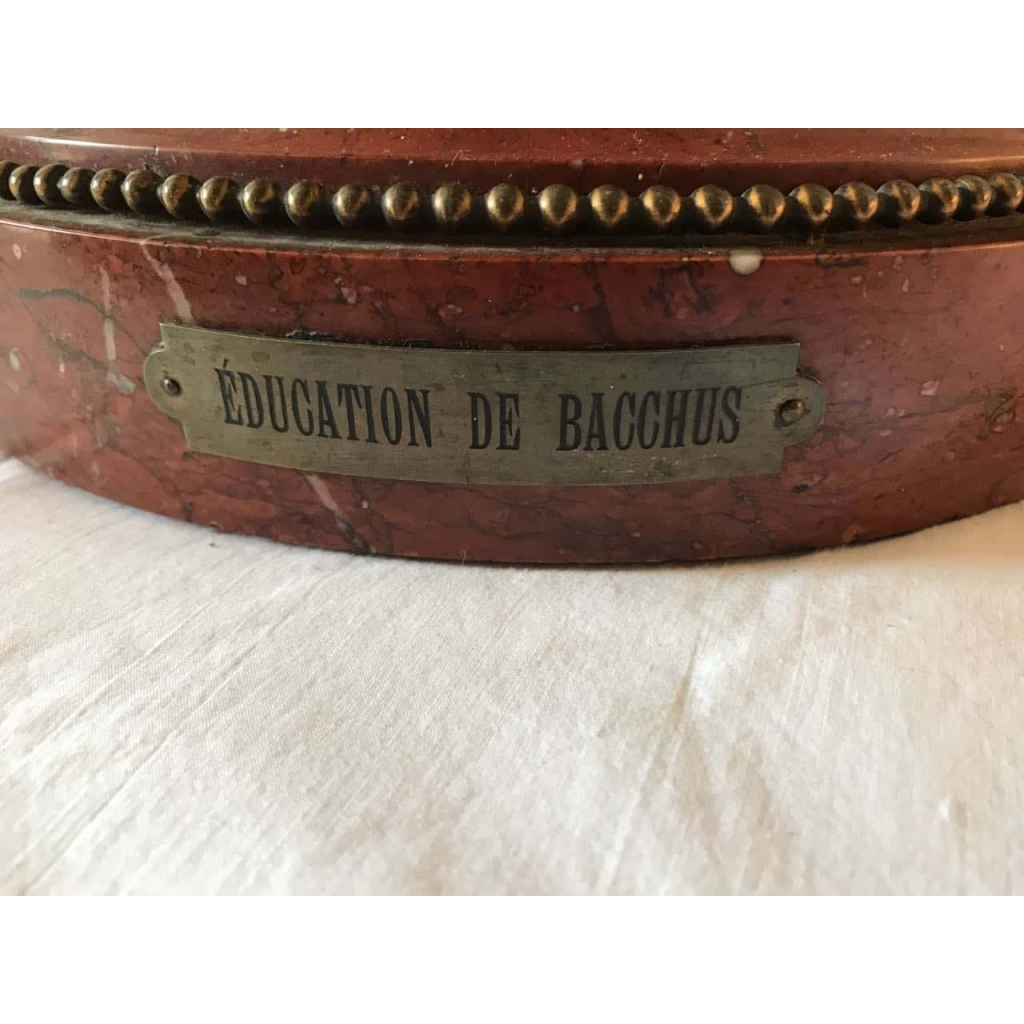 Bronze à patine brune sur socle de marbre griotte, rotatif « L’éducation de Bacchus » par Clodion. Ref: Charles 02. | Biron Bronze à patine brune sur socle de marbre griotte, rotatif "L'éducation de Bacchus" par Clodion. Ref: Charles 02.