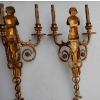 1900′ Paire d Appliques à Deux Bras de Lumière de Style Louis XVI en Bronze Doré d’Après un Modèle de Jean HAURE à Décor de Bustes d’Enfants Musiciens | Biron 1900' Paire d Appliques à Deux Bras de Lumière de Style Louis XVI en Bronze Doré d'Après un Modèle de Jean HAURE à Décor de Bustes d'Enfants Musiciens