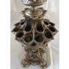 Porte cigares, boite d’allumettes et lampe à huile, en bronze argenté, à motifs égyptiens, monogrammé E.L. Réf: 299 | Biron Porte cigares, boite d'allumettes et lampe à huile, en bronze argenté, à motifs égyptiens, monogrammé E.L. Réf: 299