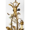 Lustre à trois branches à décor de fleurs de porcelaine. Circa 1900. | Biron Lustre à trois branches à décor de fleurs de porcelaine. Circa 1900.