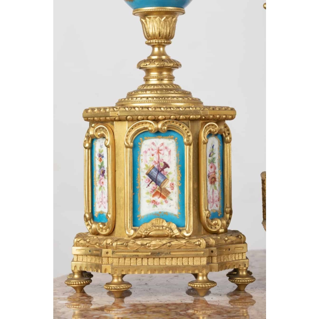 A French 19th Century Louis XVI St. Ormulu and Sèvres Porcelain Garniture. | Biron A French 19th Century Louis XVI St. Ormulu and Sèvres Porcelain Garniture.