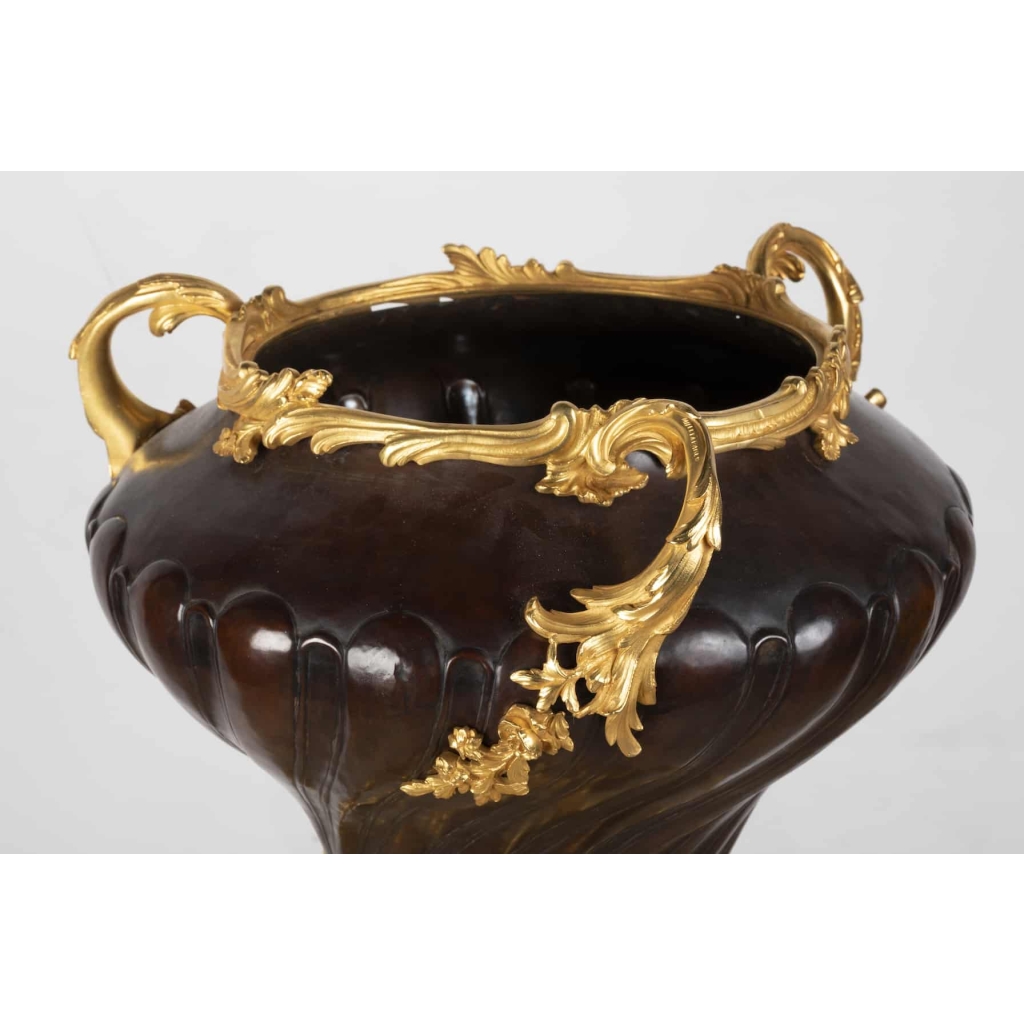 A French 19th Century Guilt and Patinated Bronze Jardinière on Stand.
