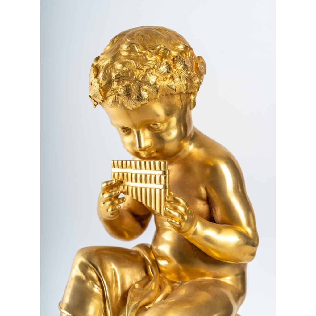 Prélude Bacchique:Enfant jouant de la Flûte de Pan.Pendule de Style Louis XVI par la Maison Charpentier. | Biron Prélude Bacchique:Enfant jouant de la Flûte de Pan.Pendule de Style Louis XVI par la Maison Charpentier.