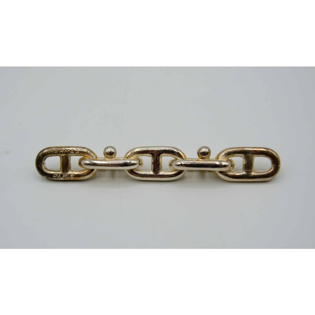 Hermès, 12 porte-couteaux en métal, XXème | Biron Hermès, 12 porte-couteaux en métal, XXème