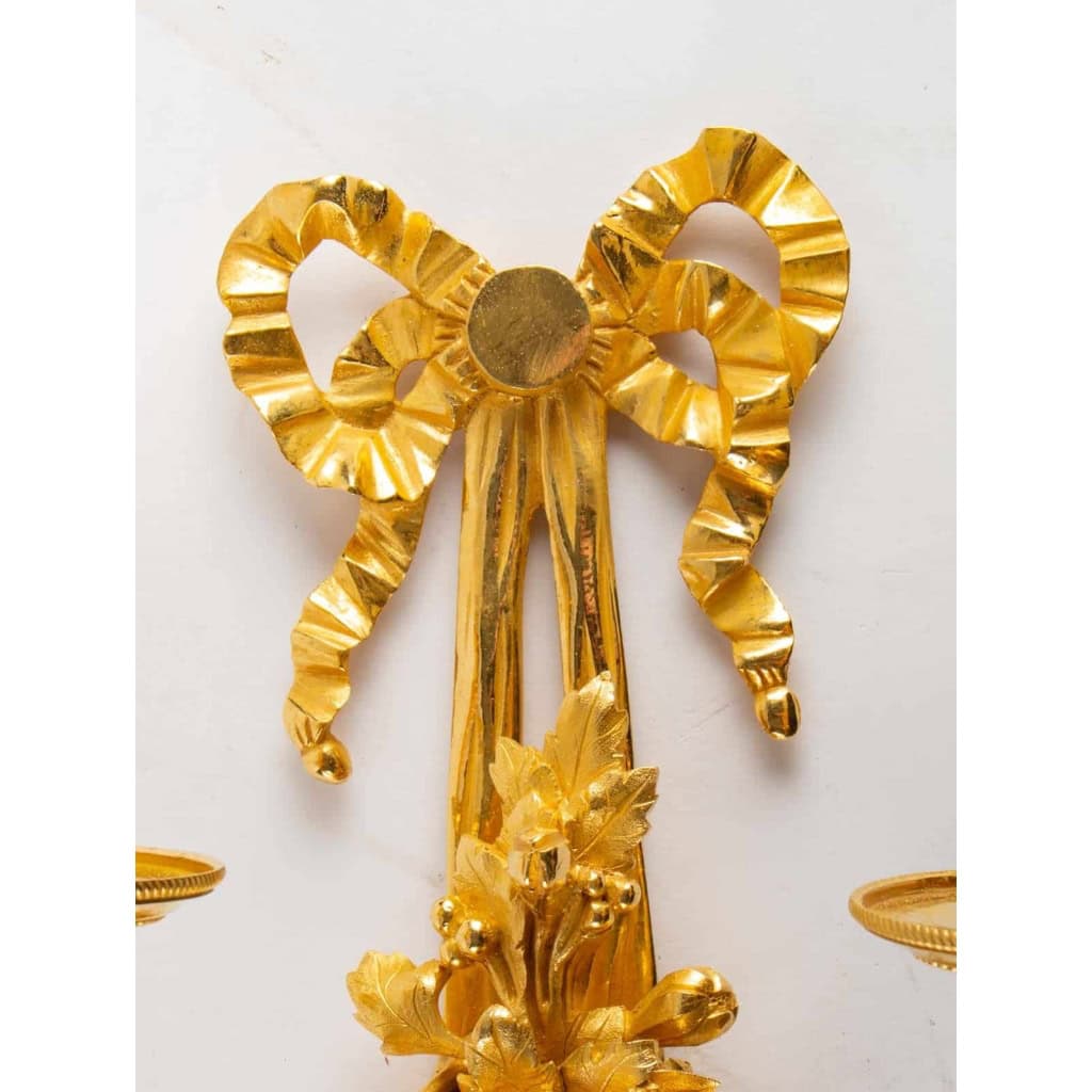 Suite de quatre appliques de style Louis XVI. | Biron Suite de quatre appliques de style Louis XVI.