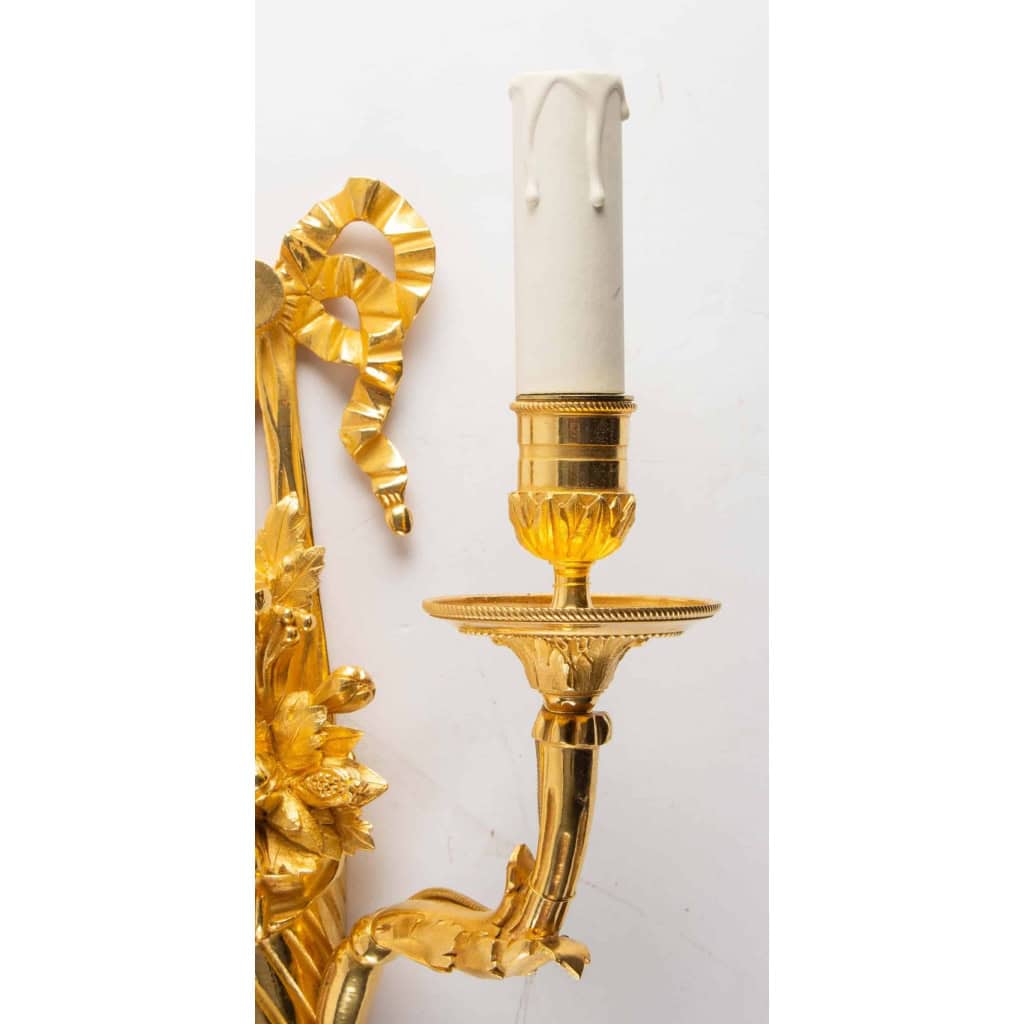 Suite de quatre appliques de style Louis XVI. | Biron Suite de quatre appliques de style Louis XVI.