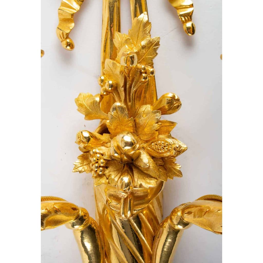 Suite de quatre appliques de style Louis XVI. | Biron Suite de quatre appliques de style Louis XVI.