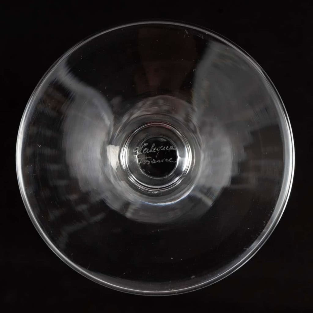 Suite de 10 flûtes à champagne « Ange de Reims » cristal blanc de Marc LALIQUE | Biron Suite de 10 flûtes à champagne "Ange de Reims" cristal blanc de Marc LALIQUE