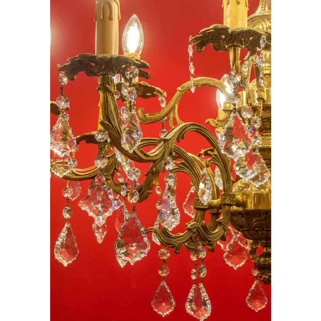 Lustre en bronze à 12 lumières, Louis XV, début XXème siècle | Biron Lustre en bronze à 12 lumières, Louis XV, début XXème siècle