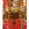 Lustre en bronze à 12 lumières, Louis XV, début XXème siècle | Biron Lustre en bronze à 12 lumières, Louis XV, début XXème siècle