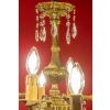 Lustre en bronze à 12 lumières, Louis XV, début XXème siècle | Biron Lustre en bronze à 12 lumières, Louis XV, début XXème siècle