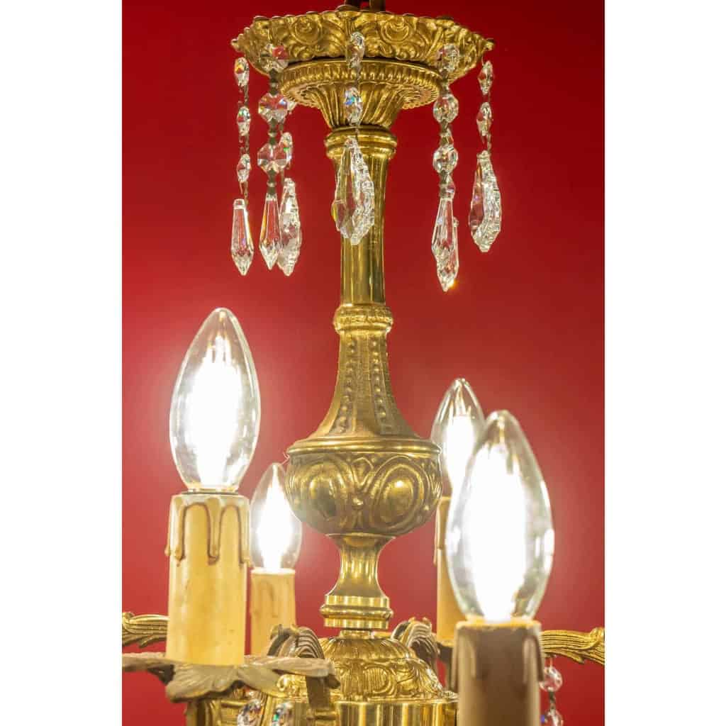 Lustre en bronze à 12 lumières, Louis XV, début XXème siècle | Biron Lustre en bronze à 12 lumières, Louis XV, début XXème siècle