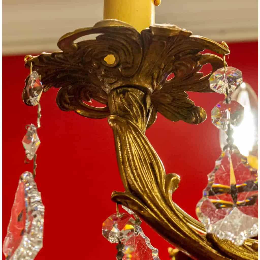 Lustre en bronze à 12 lumières, Louis XV, début XXème siècle | Biron Lustre en bronze à 12 lumières, Louis XV, début XXème siècle