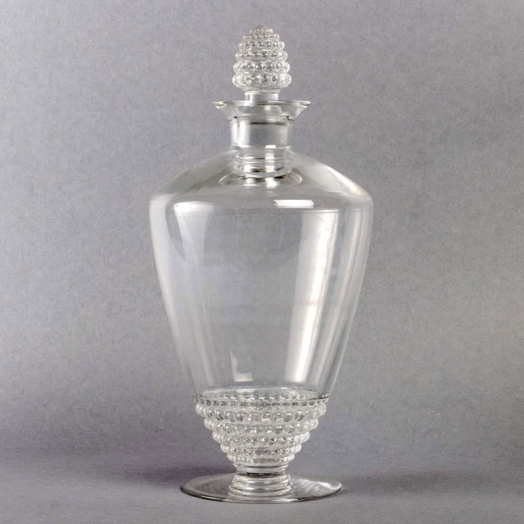 Service « Nippon » verre blanc 32 Pièces (30 Verres + 1 Broc + 1 Carafe) de René LALIQUE | Biron Service "Nippon" verre blanc 32 Pièces (30 Verres + 1 Broc + 1 Carafe) de René LALIQUE