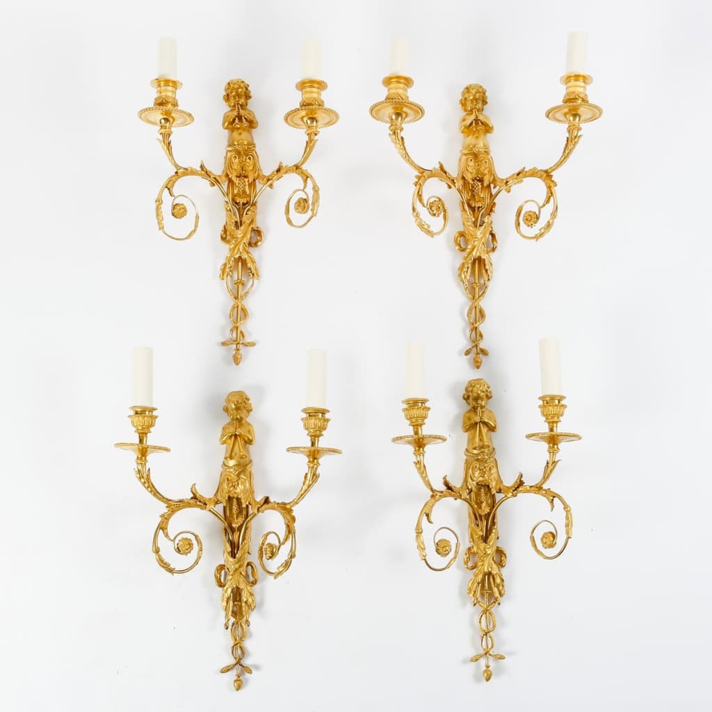 Suite de quatre appliques de style Louis XVI. | Biron |||||