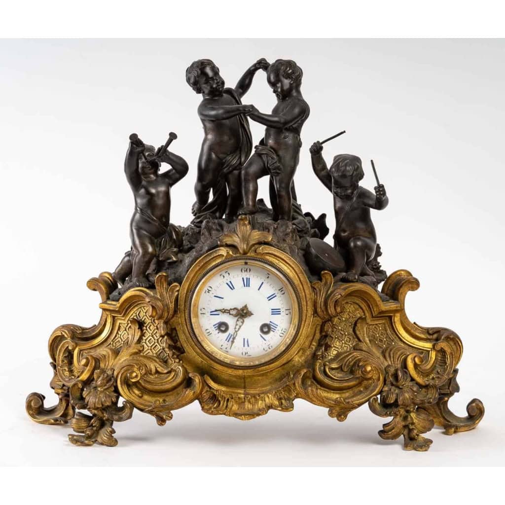 Pendule en bronze doré et patine. XIXème siècle | Biron ||||||||||