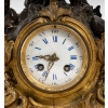 Pendule en bronze doré et patine. XIXème siècle | Biron Pendule en bronze doré et patine. XIXème siècle