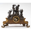 Pendule en bronze doré et patine. XIXème siècle | Biron Pendule en bronze doré et patine. XIXème siècle