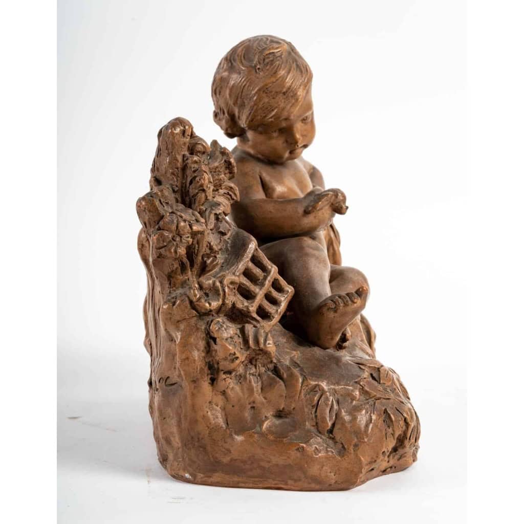 Terre Cuite Représentant un Enfant et un Oiseau, Début du XXème Siècle | Biron Terre Cuite Représentant un Enfant et un Oiseau, Début du XXème Siècle