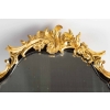 Un miroir mural ou à poser de style Napoléon III en bronze doré et bois noirci. | Biron Un miroir mural ou à poser de style Napoléon III en bronze doré et bois noirci.