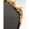 Un miroir mural ou à poser de style Napoléon III en bronze doré et bois noirci. | Biron Un miroir mural ou à poser de style Napoléon III en bronze doré et bois noirci.