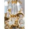 Un lustre en bronze doré à douze bras de lumières fin XIXème siècle | Biron Un lustre en bronze doré à douze bras de lumières fin XIXème siècle