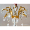 Un lustre en bronze doré à douze bras de lumières fin XIXème siècle | Biron Un lustre en bronze doré à douze bras de lumières fin XIXème siècle