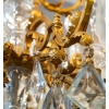 Un lustre en bronze doré à douze bras de lumières fin XIXème siècle | Biron Un lustre en bronze doré à douze bras de lumières fin XIXème siècle