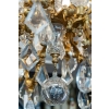 Un lustre en bronze doré à douze bras de lumières fin XIXème siècle | Biron Un lustre en bronze doré à douze bras de lumières fin XIXème siècle